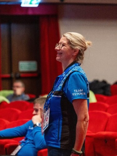 Coach Ele Jarvis smiles as she watches Helen practice her dance routine. Photo by: Claire Behan.