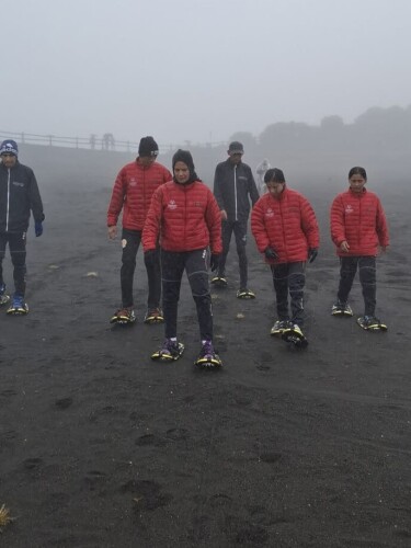 Through fog and rain, Ashly (far right) and Emily (second to the right) train for snowshoeing atop Volcan Irazu in Cartago, Costa Rica.